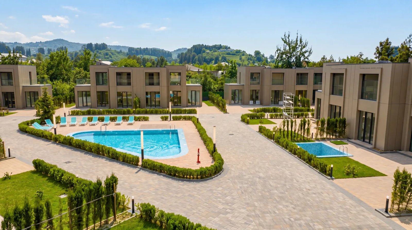 Completed Villa Park homes and landscaped grounds around the pool