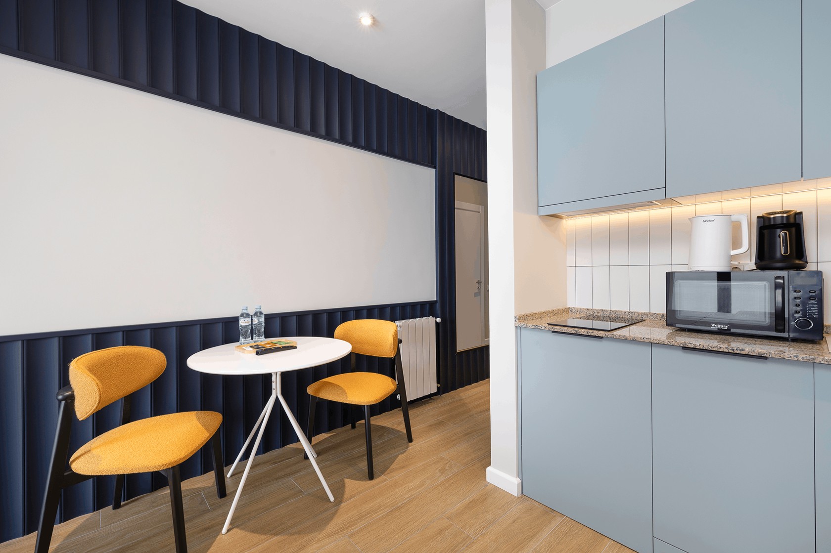 NEXT White kitchen and dining area